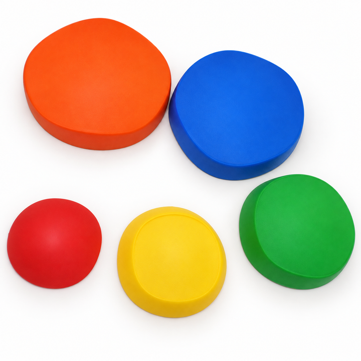 Five colourful stackable stepping stones on a clean white background